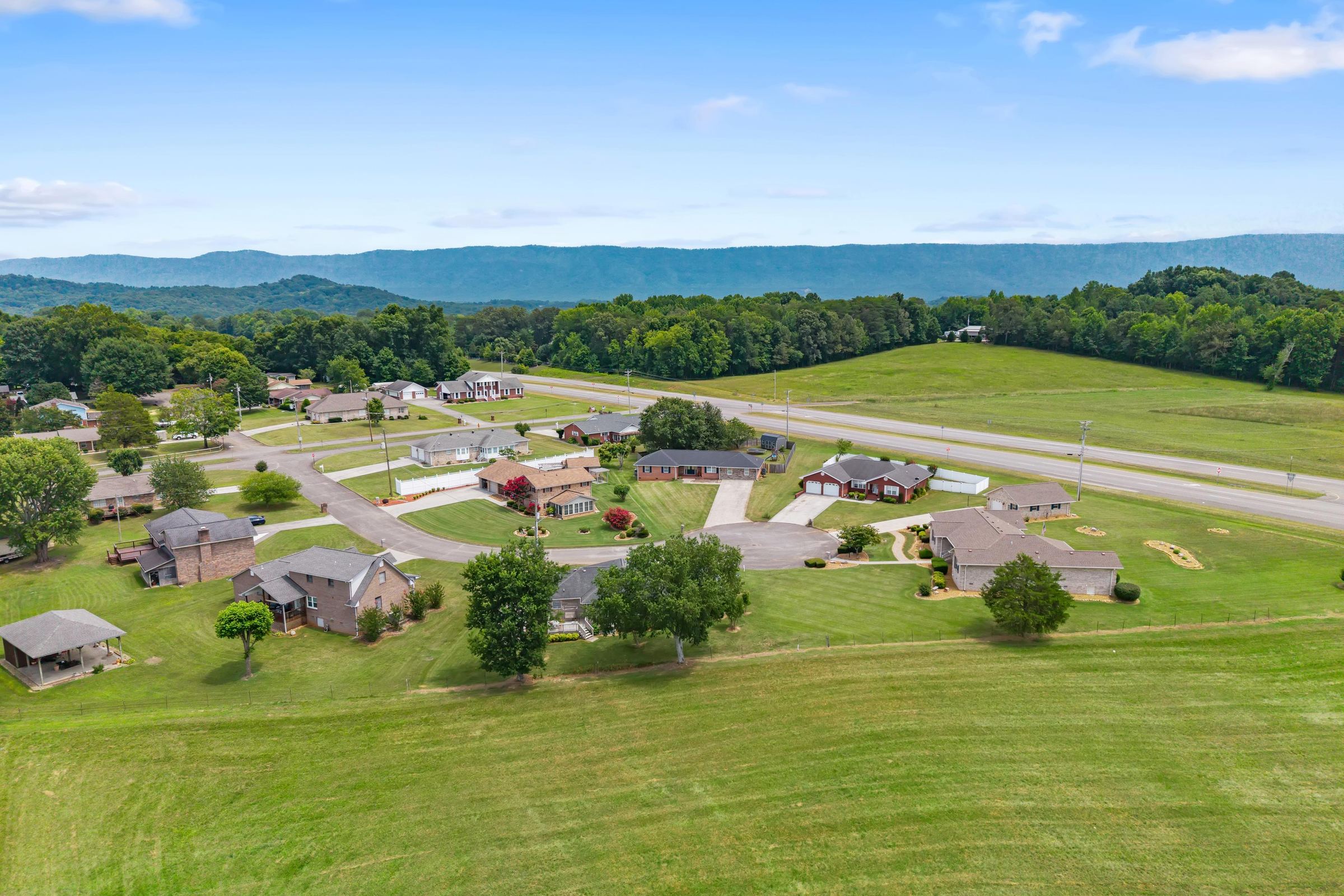 Aerial view over the neighborhood toward the mountains